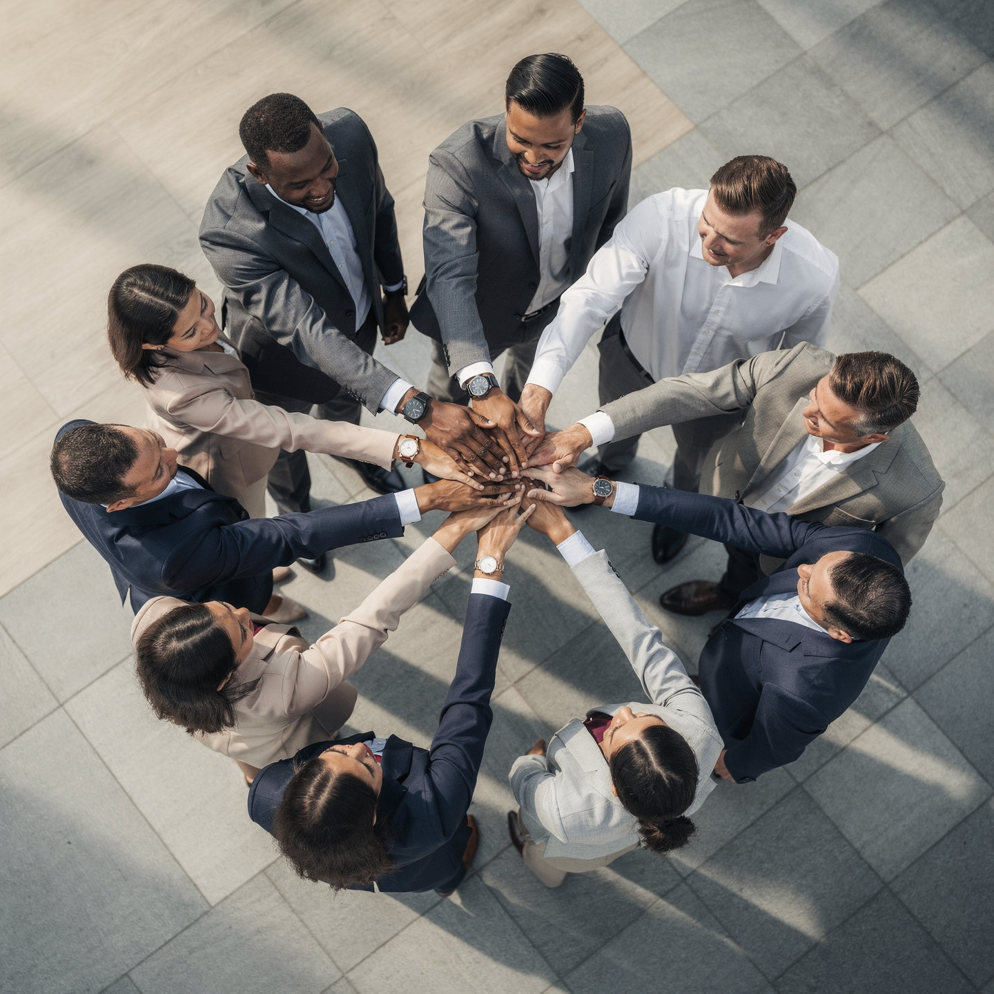 Hands joined in partnership, viewed from above